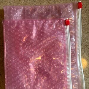 Two new and unused Glossier pink bubble makeup bags, two sizes